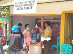 Bhabinkamtibmas Olilit Timur Pantau Pergerakan Warga Pada Posko Covid 19