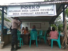 Sambangi Posko Covid 19 Desa Sangliat Krawain,Bhabinkamtibmas Sosialisasi Maklumat Kapolri