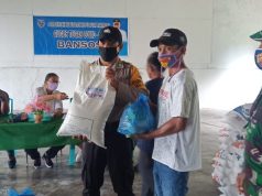 Bhabinkamtibmas Desa Wowonda Kawal Ketat Pembagian Bansos Bagi Warga Terdampak Covid 19