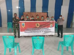 Cegah Pungli, Bhabinkamtibmas Lorulun dan Babinsa giat Sosialisasi Saber Pungli