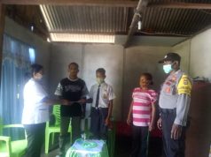 Bhabinkamtibmas Latdalam turut terlibat sekaligus amankan giat pembagian hasil Ujian SMP N. 7 Tanimbar Selatan