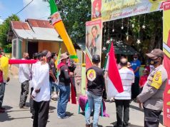 Bhabinkamtibmas Olilit Barat Pengamanan dan Pengawalan Perarakan Arca Kristus Raja Antar Rukun